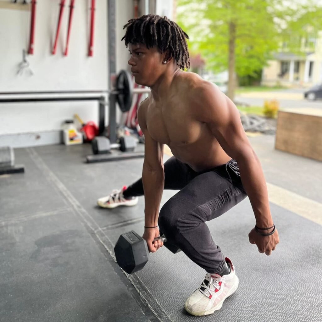 Athlete performing weighted left leg stretches