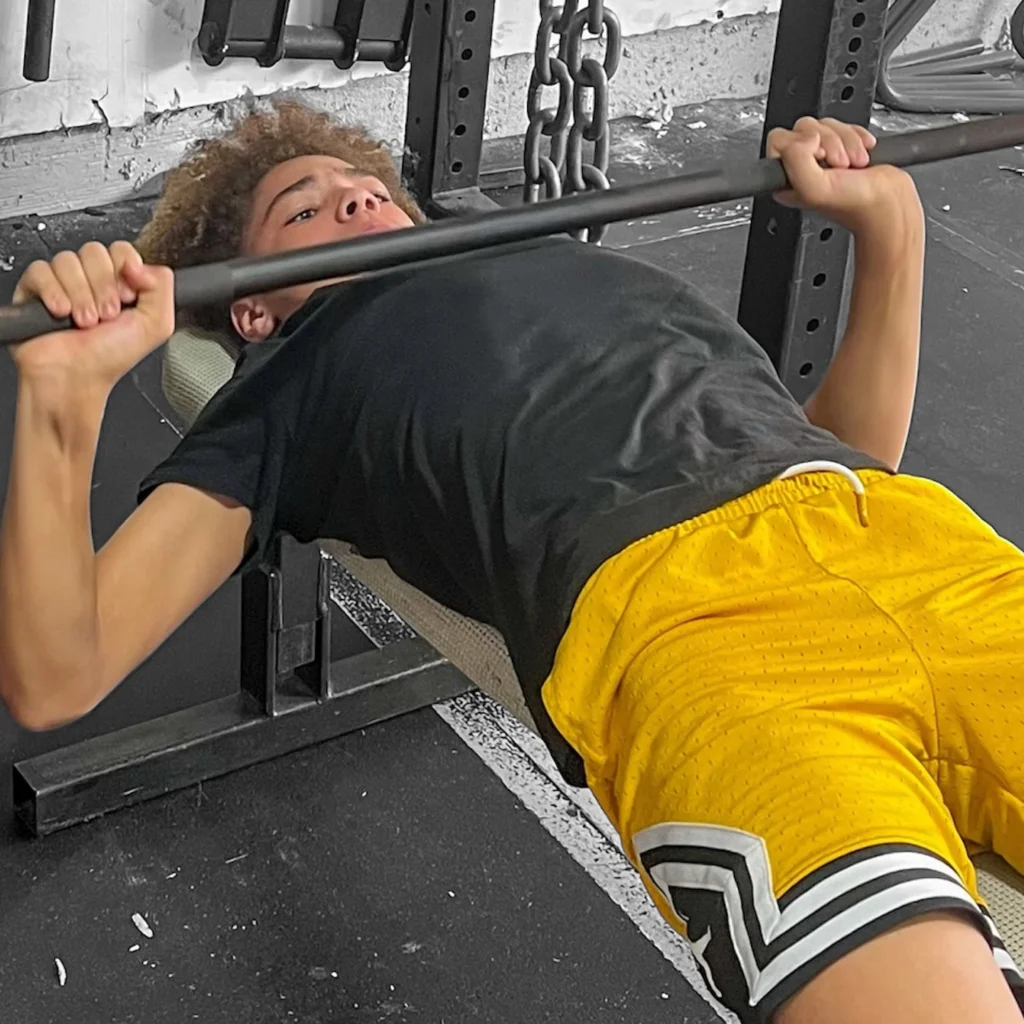 Athlete performing barbell bench press